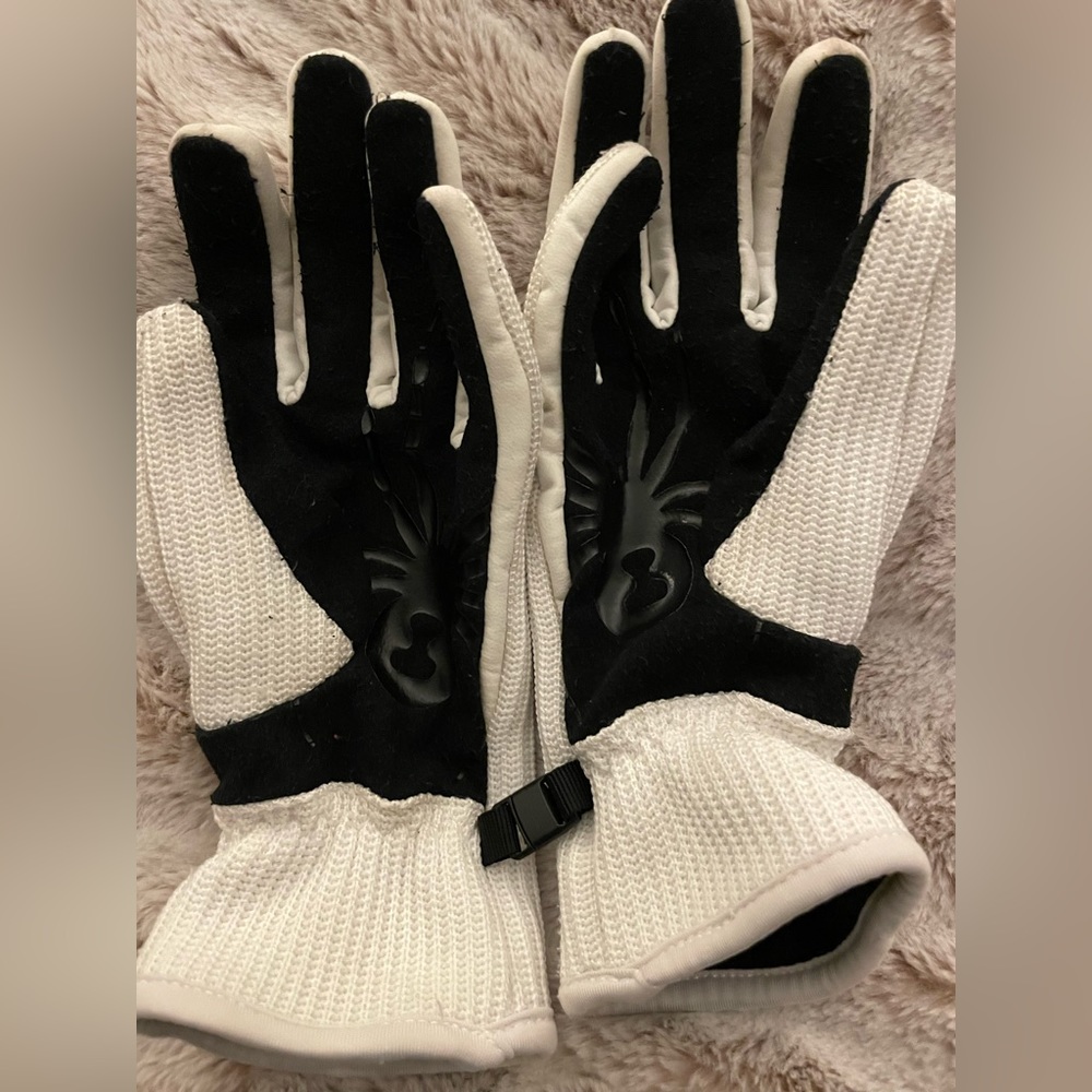 2 pair of gloves one north face and one spyder size S